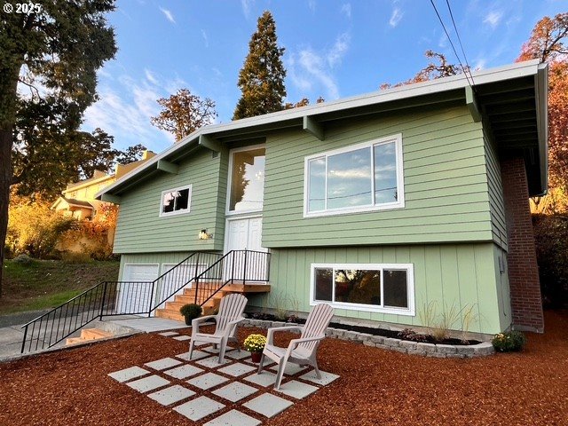 552 West D Street Springfield, OR 97477 - Photo 3 of 29 a backyard of a house with table and chairs