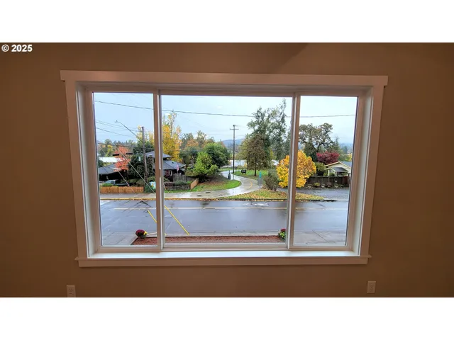 a open kitchen view with wooden floor and stainless steel appliances