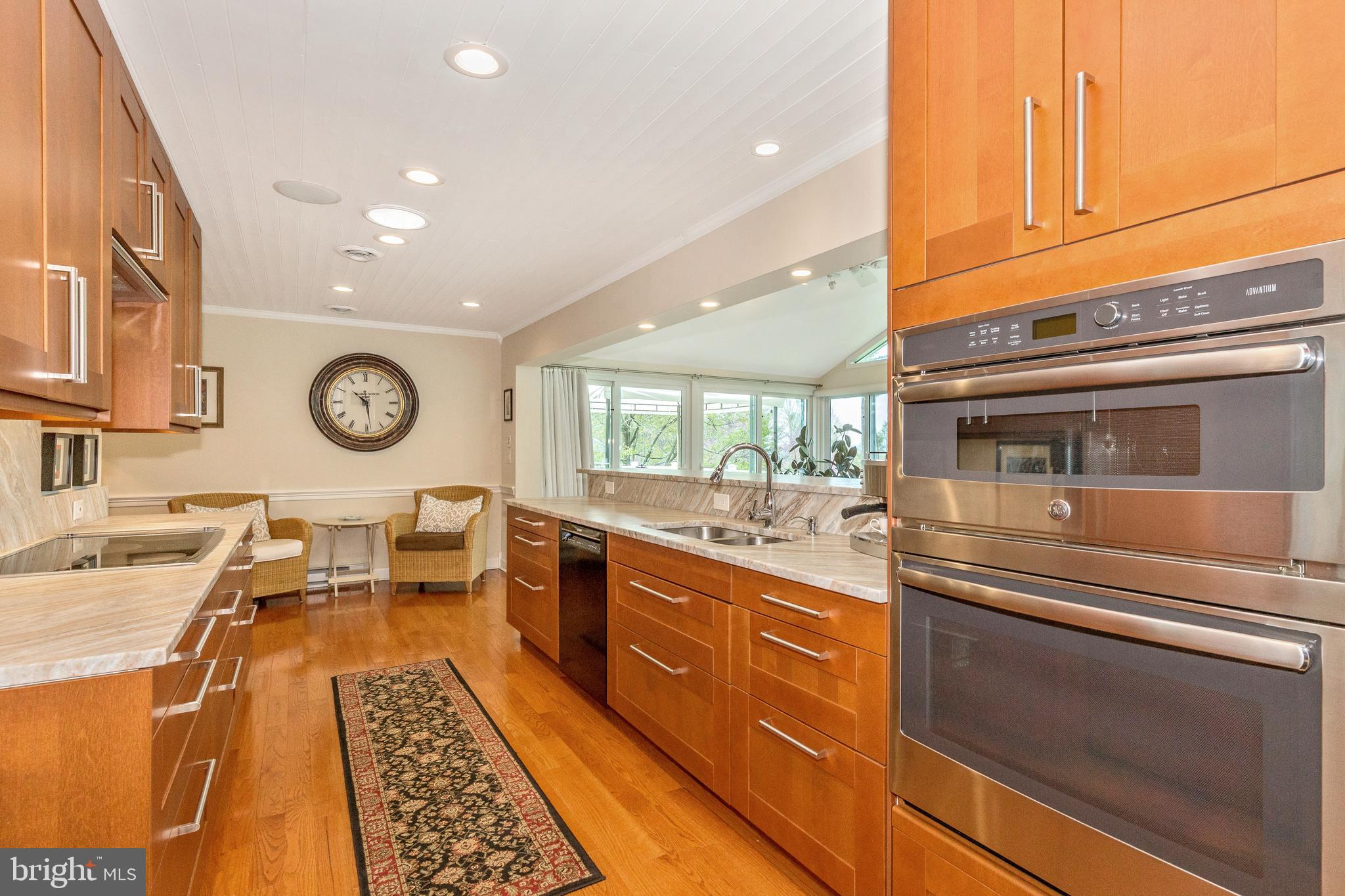 5506 Woodlyn Road Frederick, MD 21703 - Photo 14 of 51 a kitchen with stainless steel appliances granite countertop a stove and cabinets