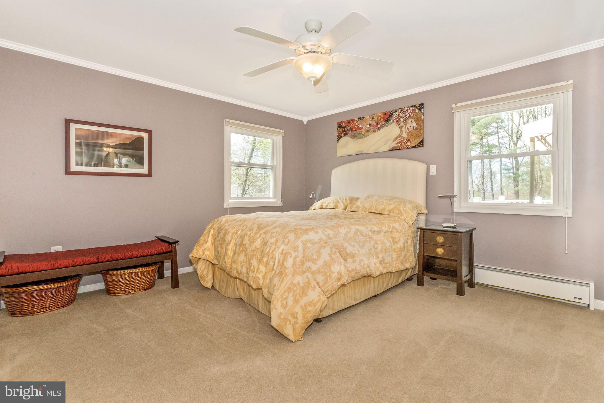 5506 Woodlyn Road Frederick, MD 21703 - Photo 20 of 51 a bed sitting in a bedroom next to a window