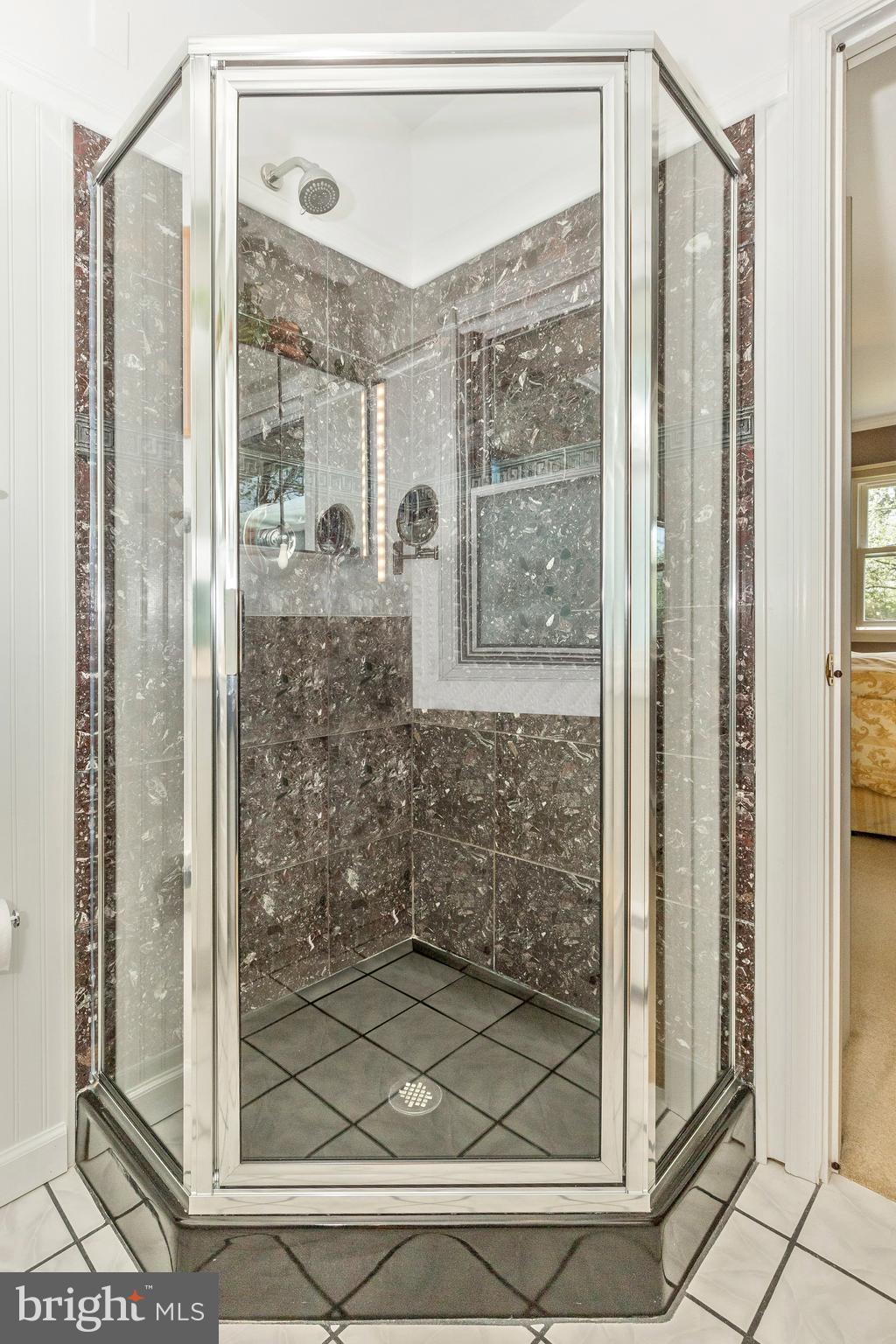 5506 Woodlyn Road Frederick, MD 21703 - Photo 25 of 51 a bathroom with a glass shower door