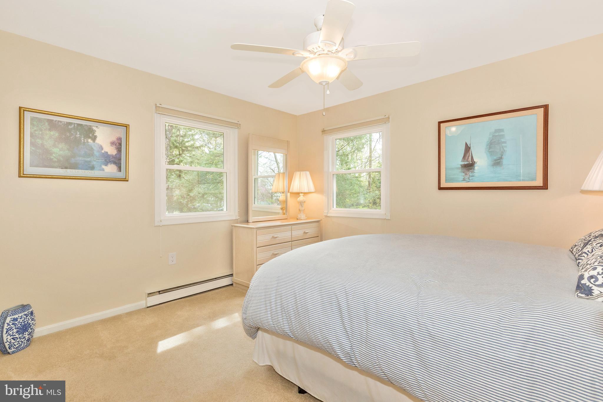 5506 Woodlyn Road Frederick, MD 21703 - Photo 26 of 51 a bedroom with a large bed and a window