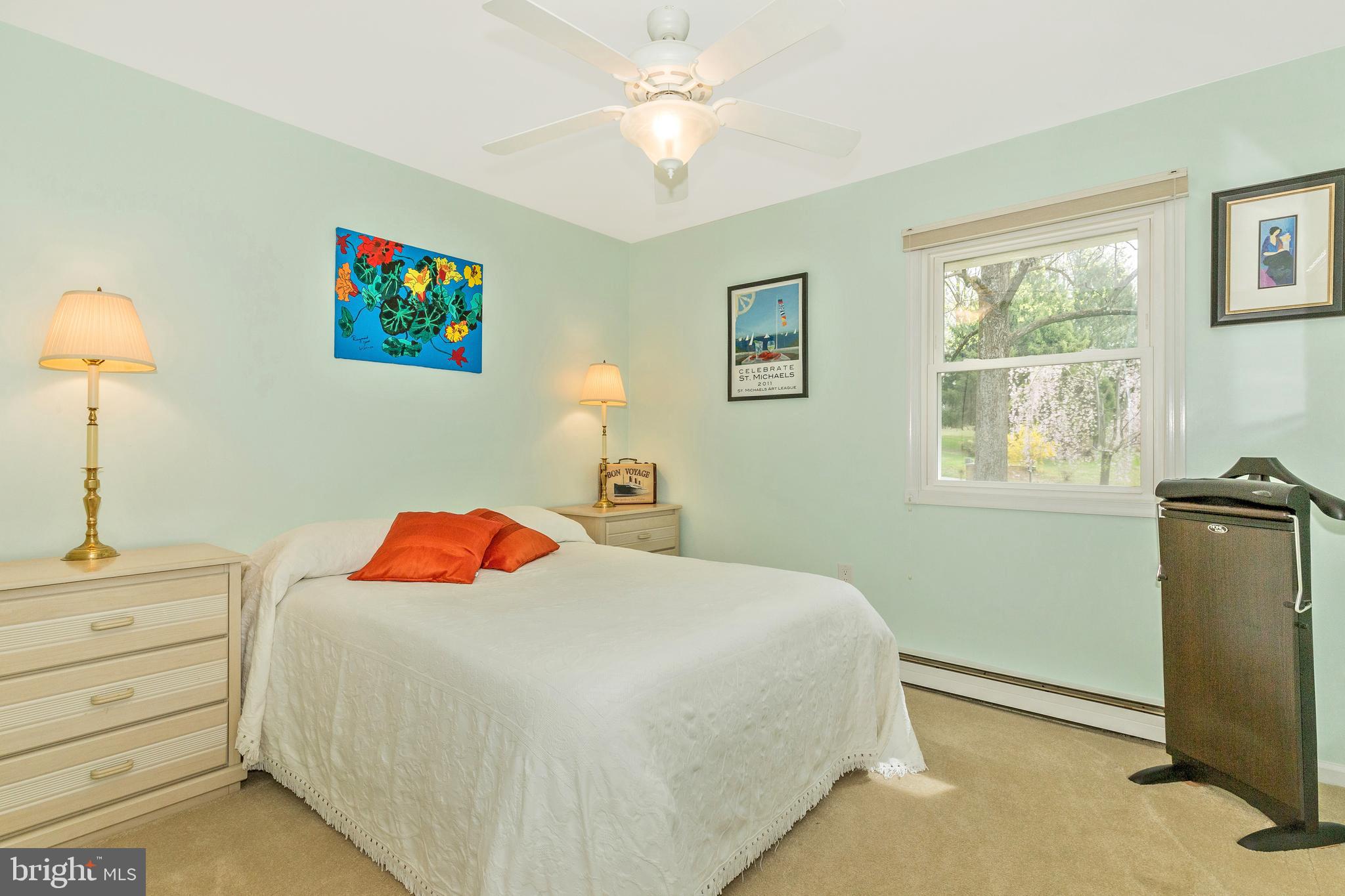 5506 Woodlyn Road Frederick, MD 21703 - Photo 27 of 51 a bedroom with a bed and a chandelier