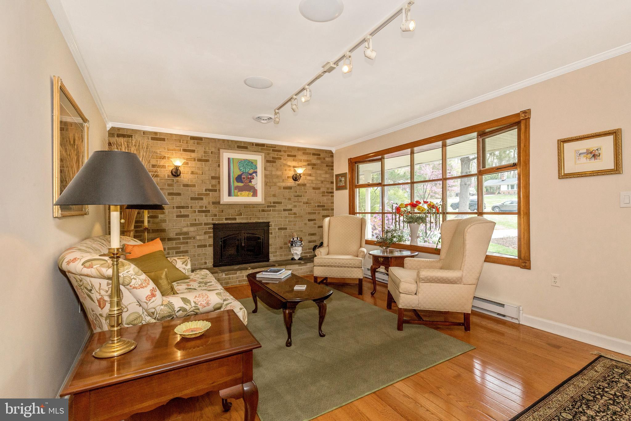 5506 Woodlyn Road Frederick, MD 21703 - Photo 5 of 51 a living room with furniture and a fireplace