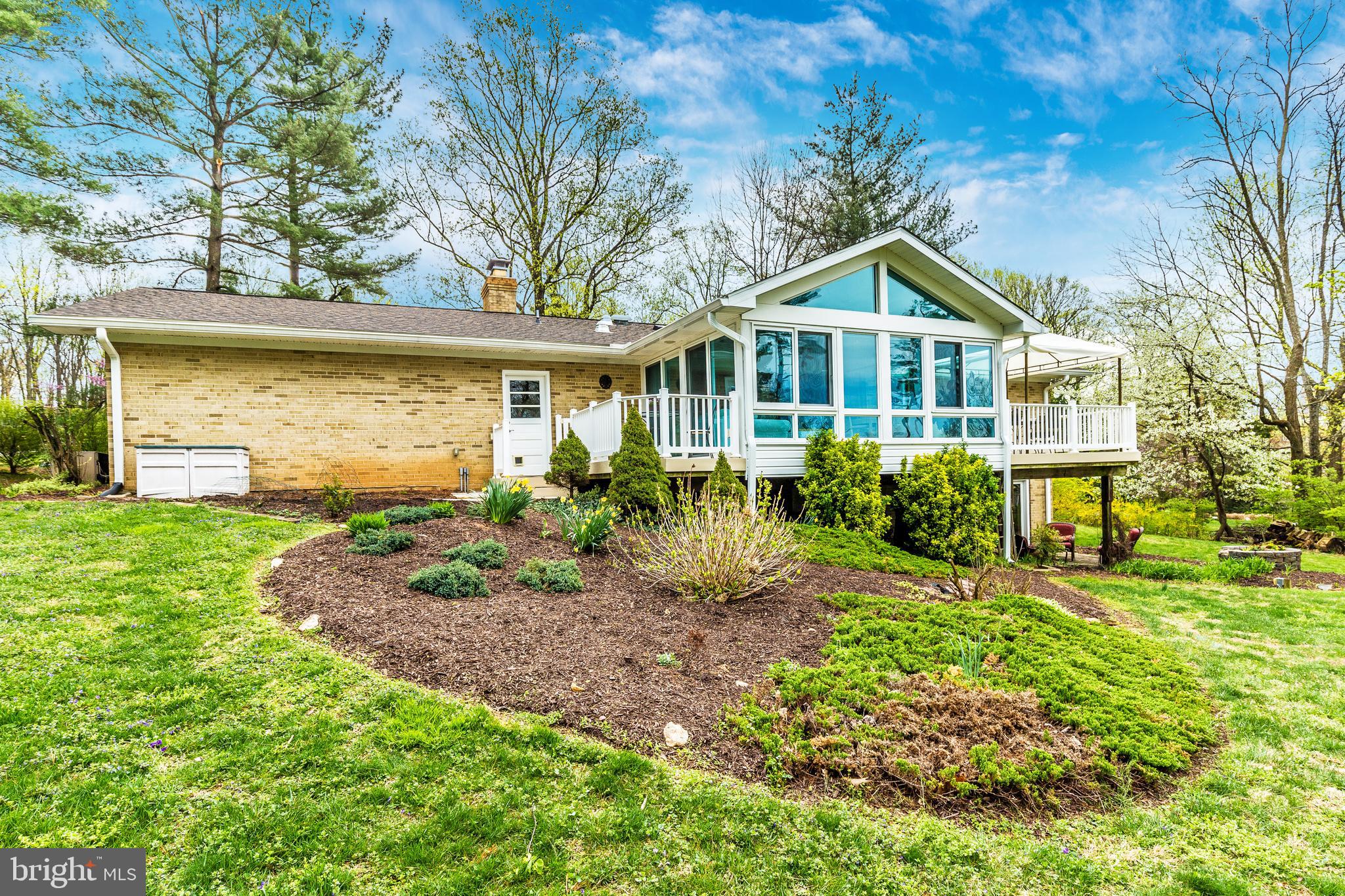 5506 Woodlyn Road Frederick, MD 21703 - Photo 42 of 51 a front view of a house with garden