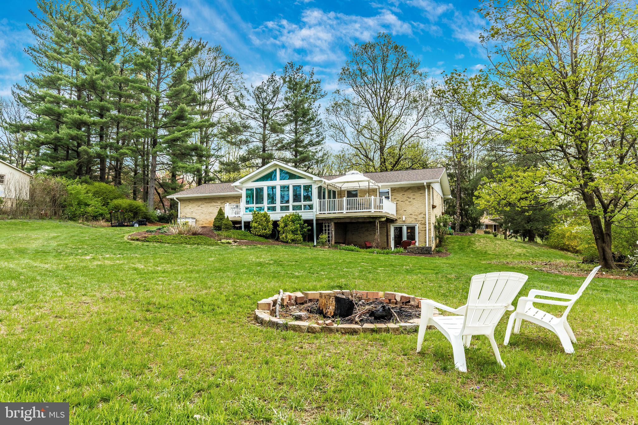5506 Woodlyn Road Frederick, MD 21703 - Photo 45 of 51 a view of a house with a yard porch and sitting area