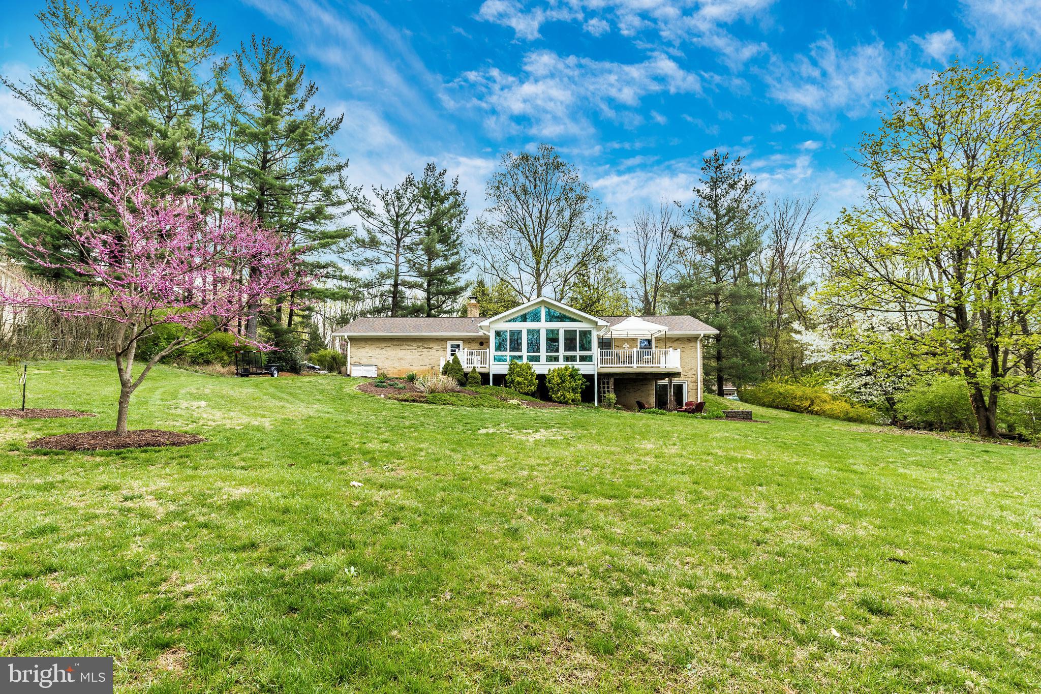 5506 Woodlyn Road Frederick, MD 21703 - Photo 46 of 51 a view of a house with a big yard and large trees