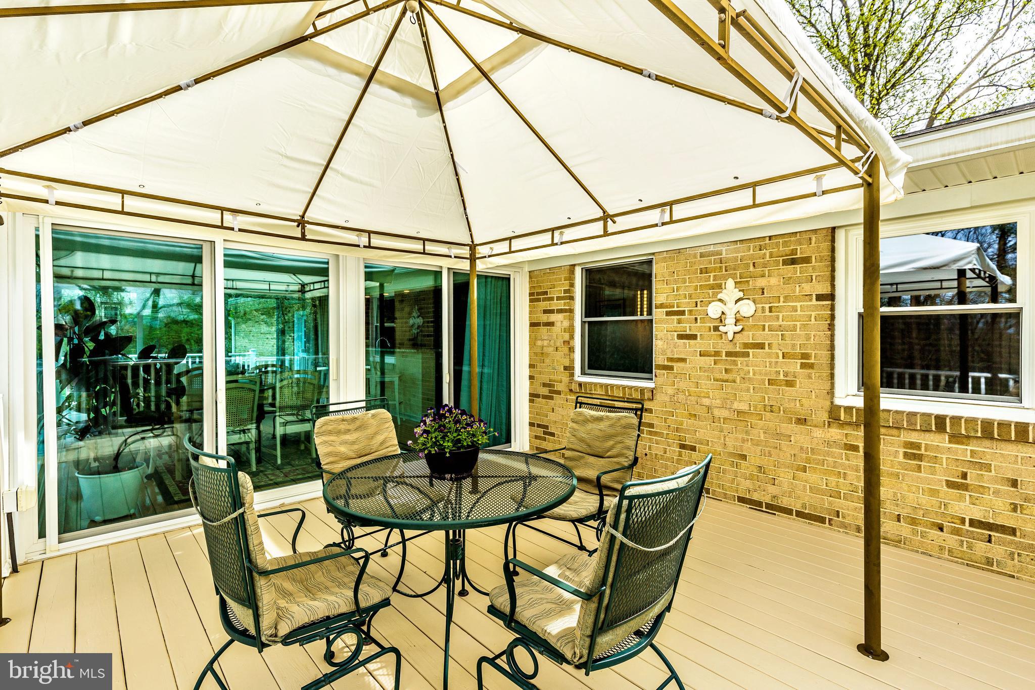 5506 Woodlyn Road Frederick, MD 21703 - Photo 50 of 51 a patio with table and chairs