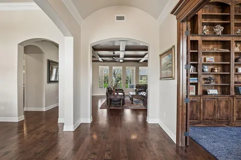 a view of living room with furniture and wooden floor