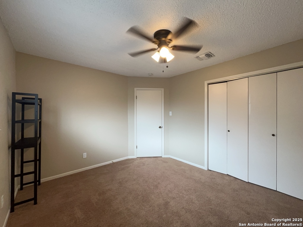 309 West Highland Drive Boerne, TX 78006 - Photo 22 of 32 a view of an empty room with a fan