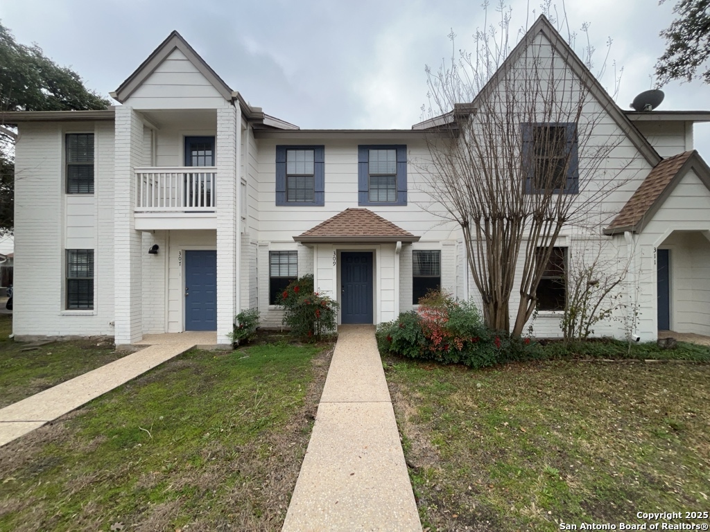 309 West Highland Drive Boerne, TX 78006 - Photo 29 of 32 a front view of a house with garden