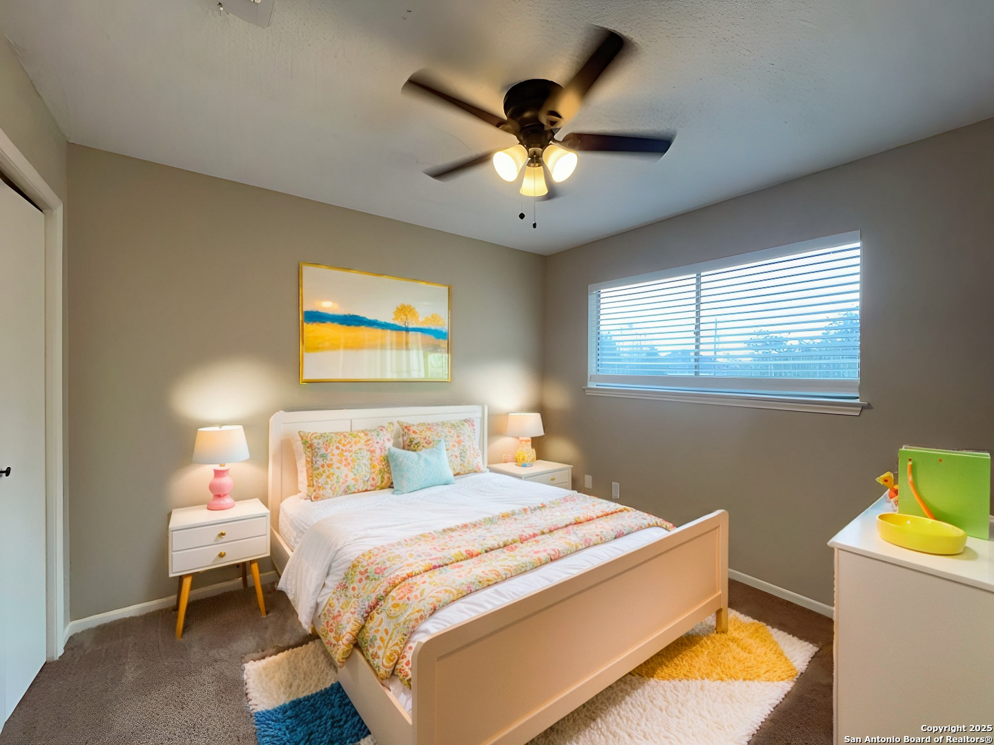 309 West Highland Drive Boerne, TX 78006 - Photo 6 of 32 a bedroom with a bed and a chandelier