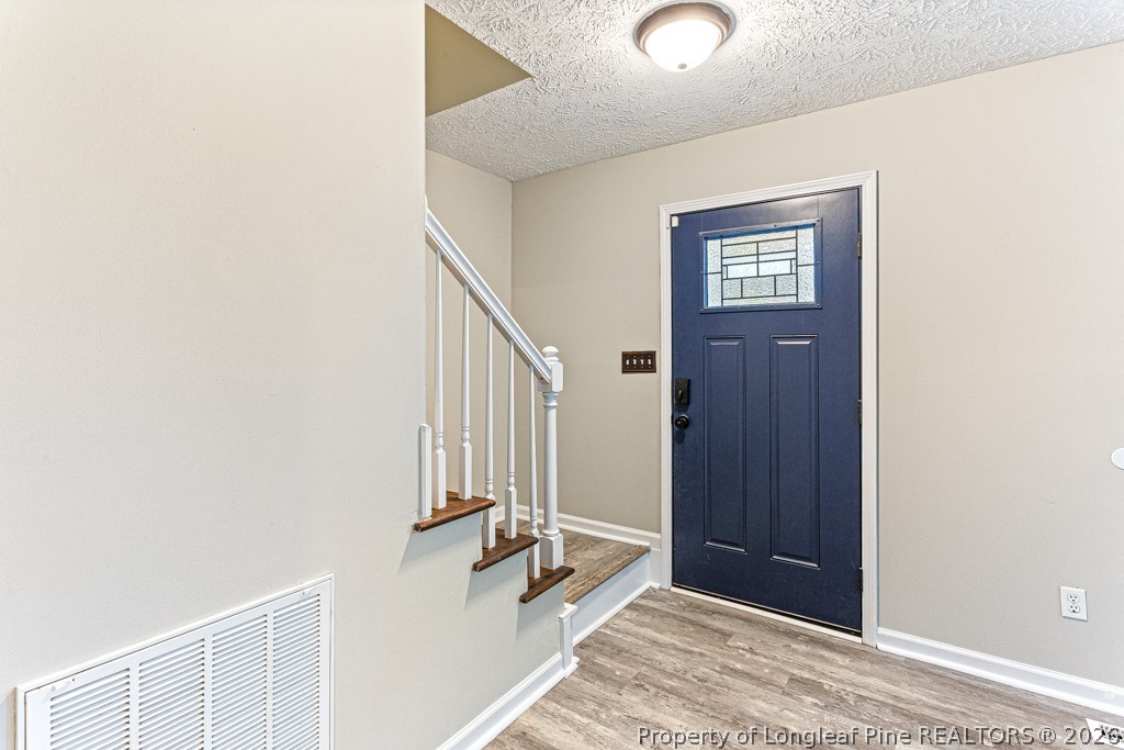 3533 Rittenour Drive Hope Mills, NC 28348 - Photo 12 of 33 a view of an entryway with staircase