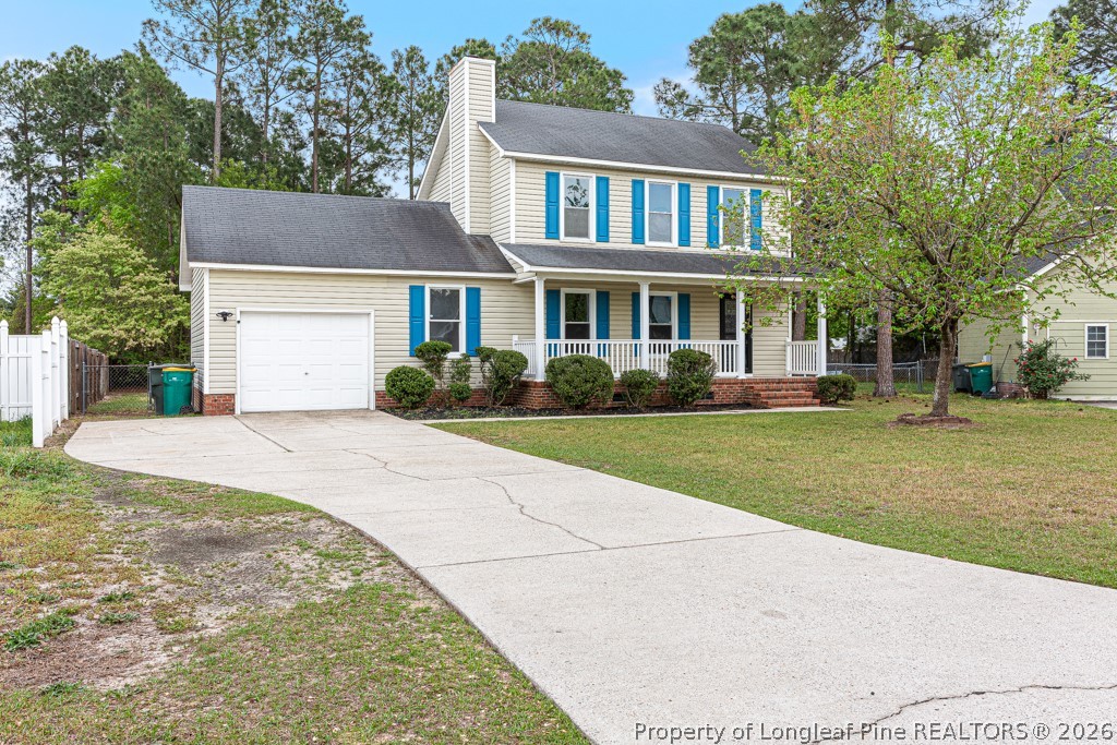 3533 Rittenour Drive Hope Mills, NC 28348 - Photo 2 of 33 a front view of a house with a garden