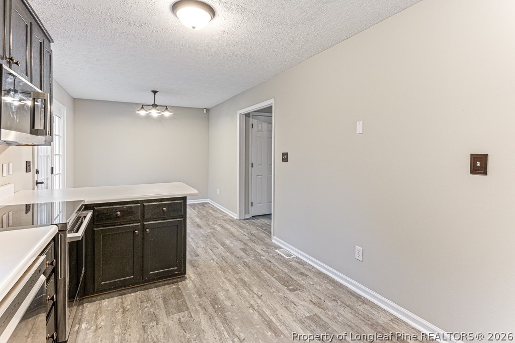 3533 Rittenour Drive Hope Mills, NC 28348 - Photo 21 of 33 a view of a kitchen with a sink cabinets and window
