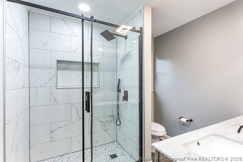 3533 Rittenour Drive Hope Mills, NC 28348 - Photo 30 of 33 a bathroom with a shower and toilet