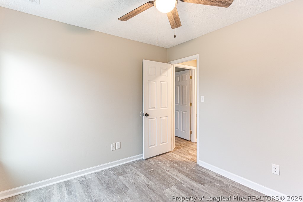 3533 Rittenour Drive Hope Mills, NC 28348 - Photo 33 of 33 an empty room with a empty space and a ceiling fan