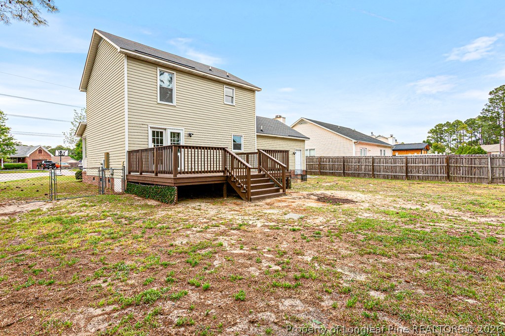 3533 Rittenour Drive Hope Mills, NC 28348 - Photo 6 of 33 a view of a house with backyard and deck