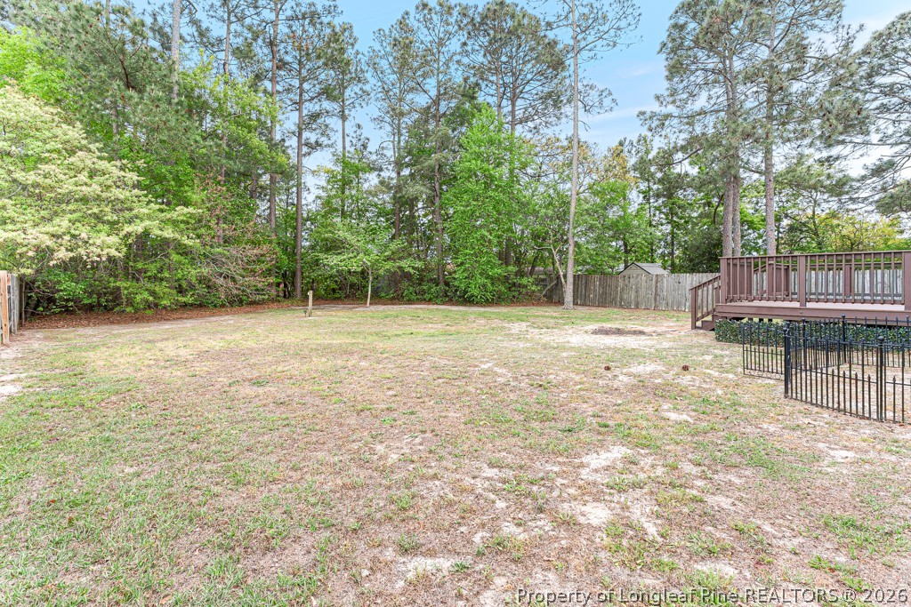 3533 Rittenour Drive Hope Mills, NC 28348 - Photo 9 of 33 a swimming pool with trees in the background