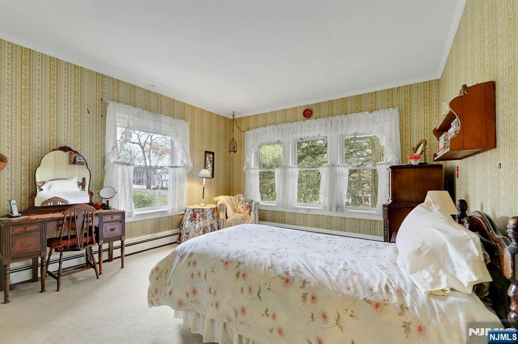 99 Armour Road Mahwah, NJ 07430 - Photo 14 of 27 a bedroom with a bed chair and a large window