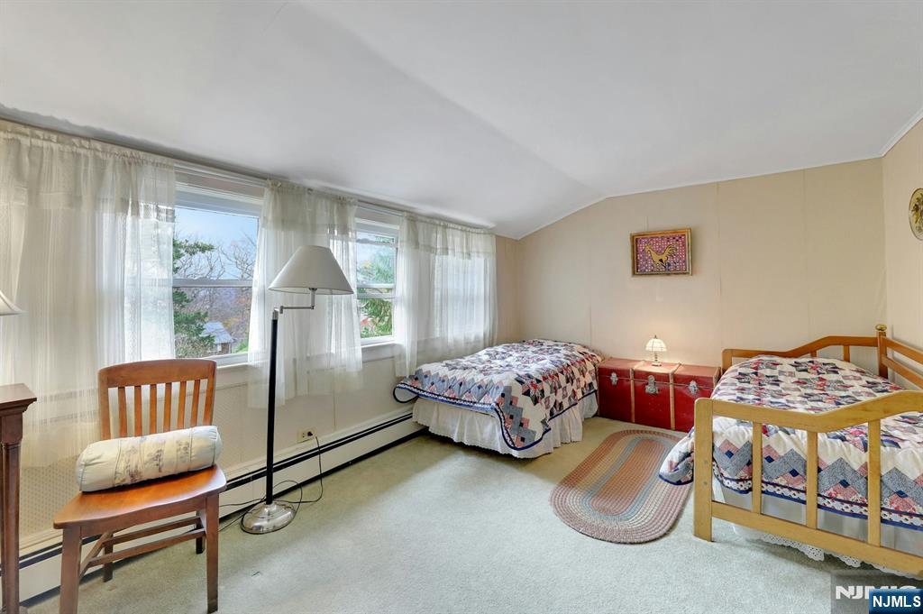 99 Armour Road Mahwah, NJ 07430 - Photo 16 of 27 a bedroom with furniture and a window