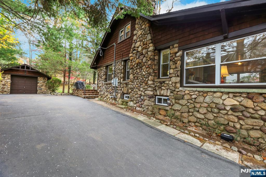 99 Armour Road Mahwah, NJ 07430 - Photo 24 of 27 a view of a house with a large window