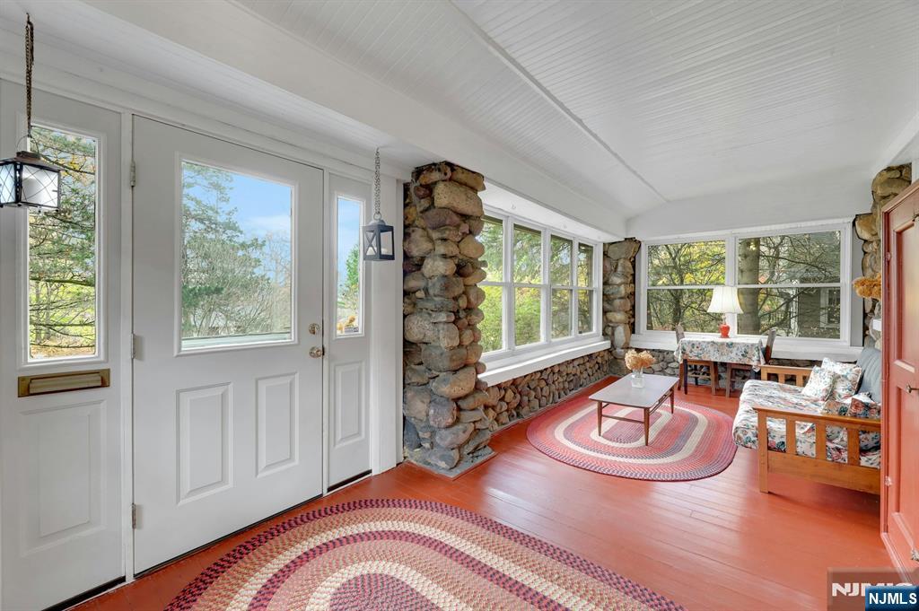 99 Armour Road Mahwah, NJ 07430 - Photo 4 of 27 a living room with furniture and a large window