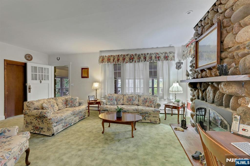 99 Armour Road Mahwah, NJ 07430 - Photo 8 of 27 a living room with furniture and a large window
