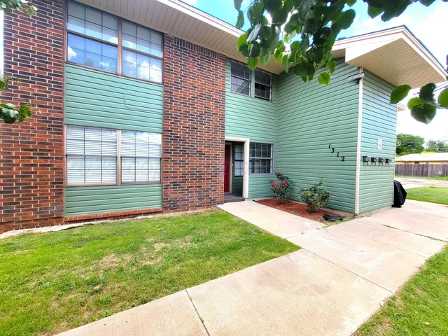 a view of a backyard with a garden