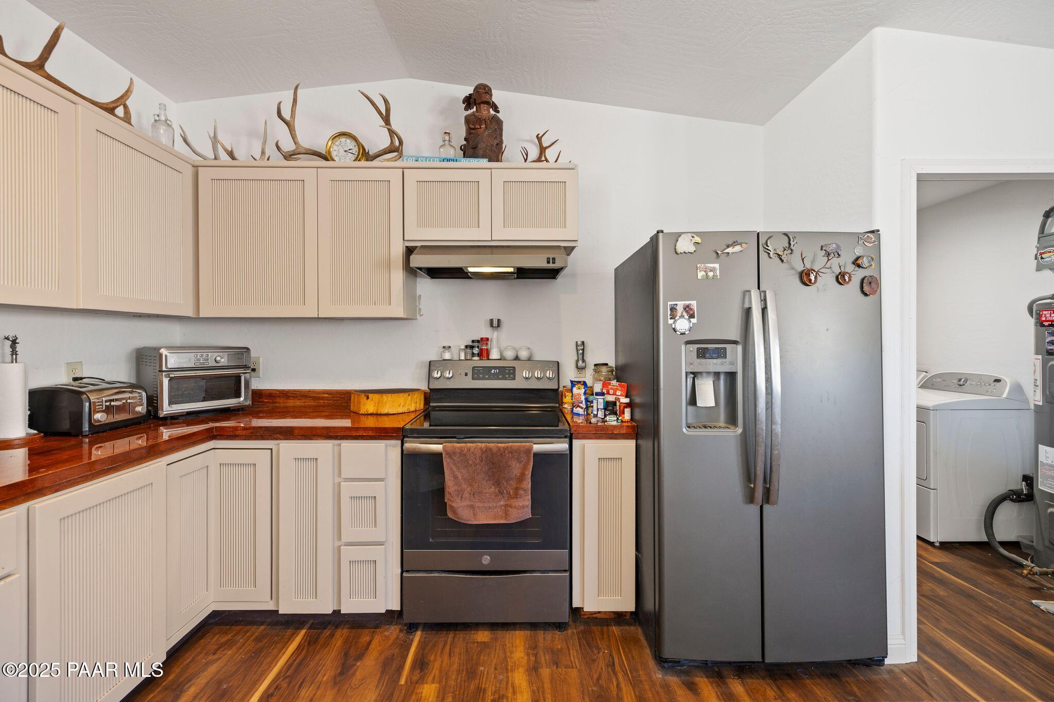 17200 South Dripping Springs Road Mayer, AZ 86333 - Photo 14 of 51 a kitchen with stainless steel appliances granite countertop a refrigerator and a stove