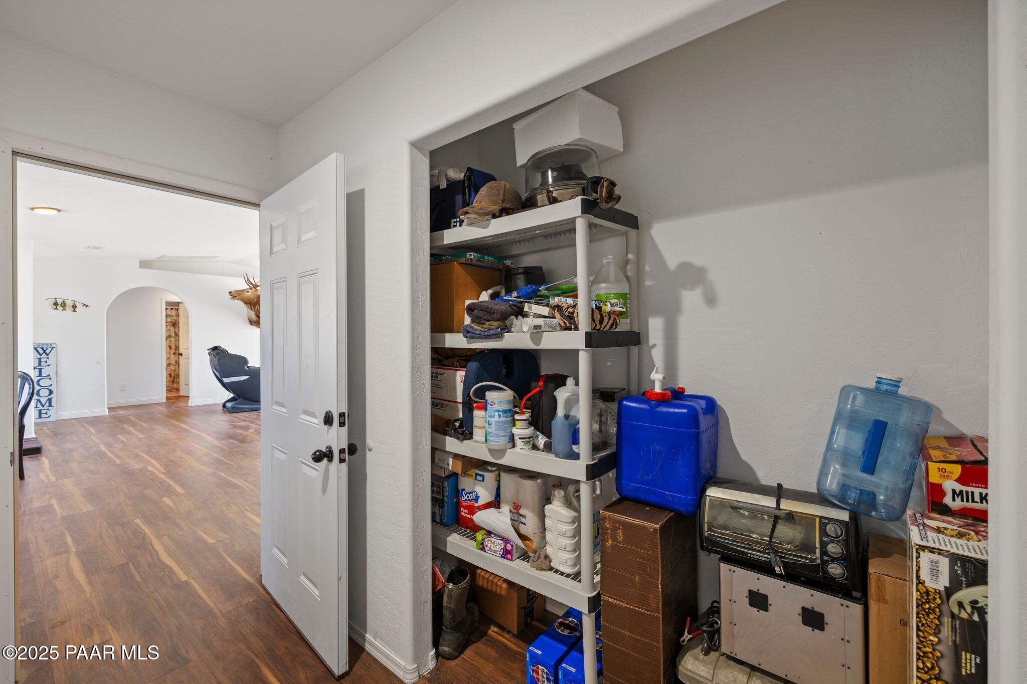 17200 South Dripping Springs Road Mayer, AZ 86333 - Photo 18 of 51 a view of walk in closet with clothes and shoes