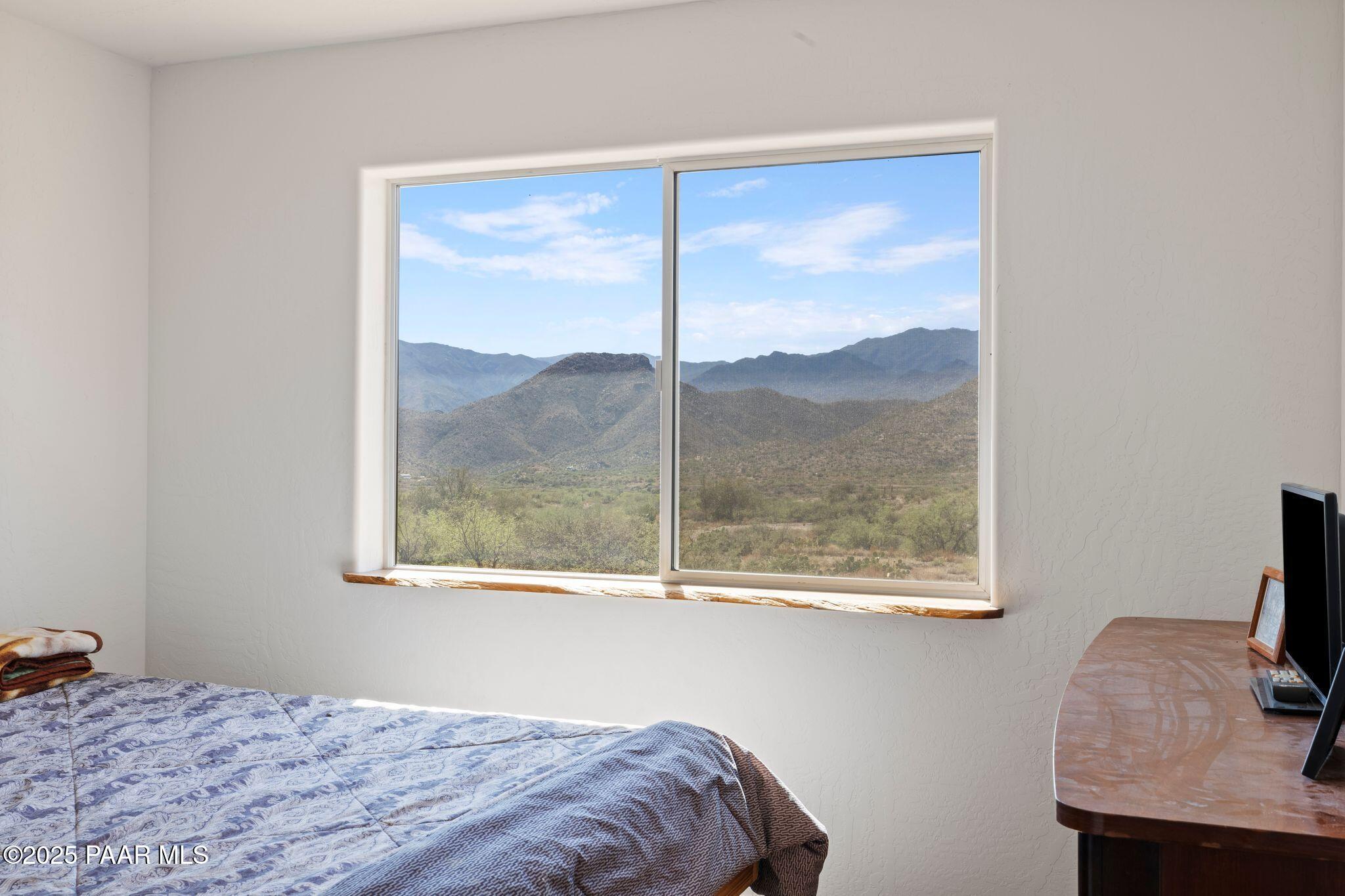 17200 South Dripping Springs Road Mayer, AZ 86333 - Photo 24 of 51 a bedroom with a bed and a window