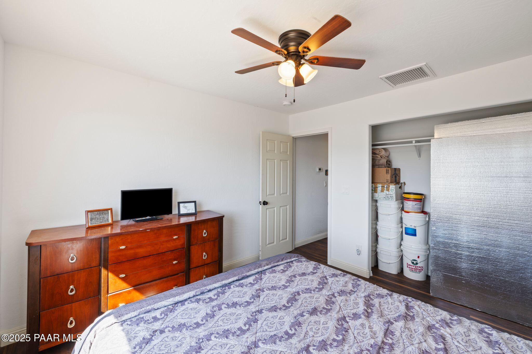 17200 South Dripping Springs Road Mayer, AZ 86333 - Photo 25 of 51 a bedroom with a bed and a flat screen tv