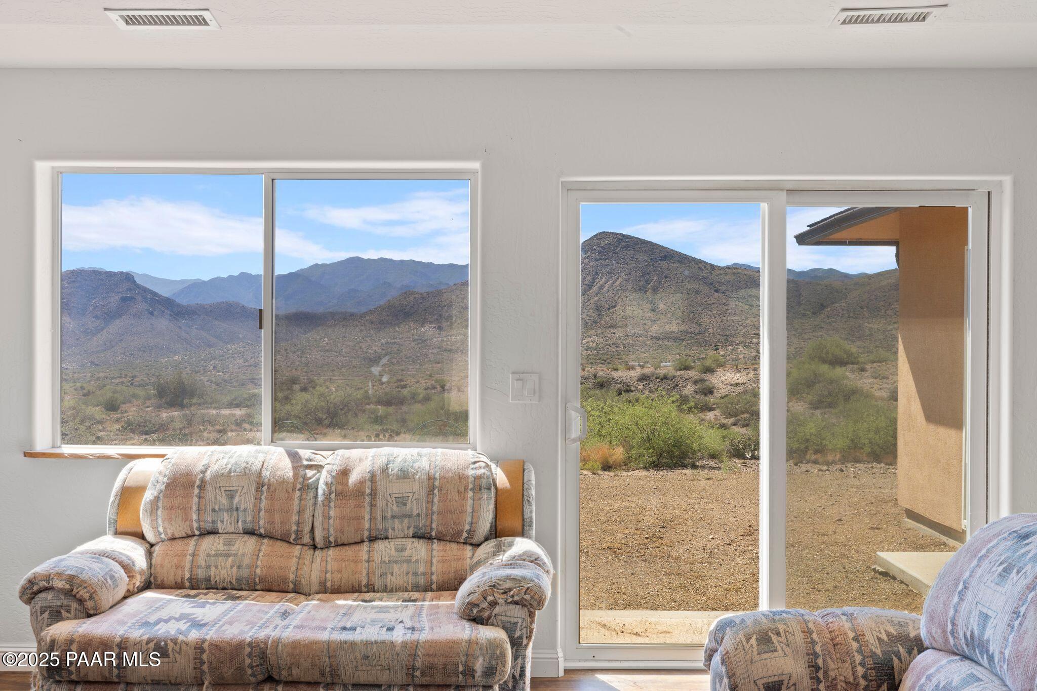 17200 South Dripping Springs Road Mayer, AZ 86333 - Photo 8 of 51 a living room with a couch and a large window