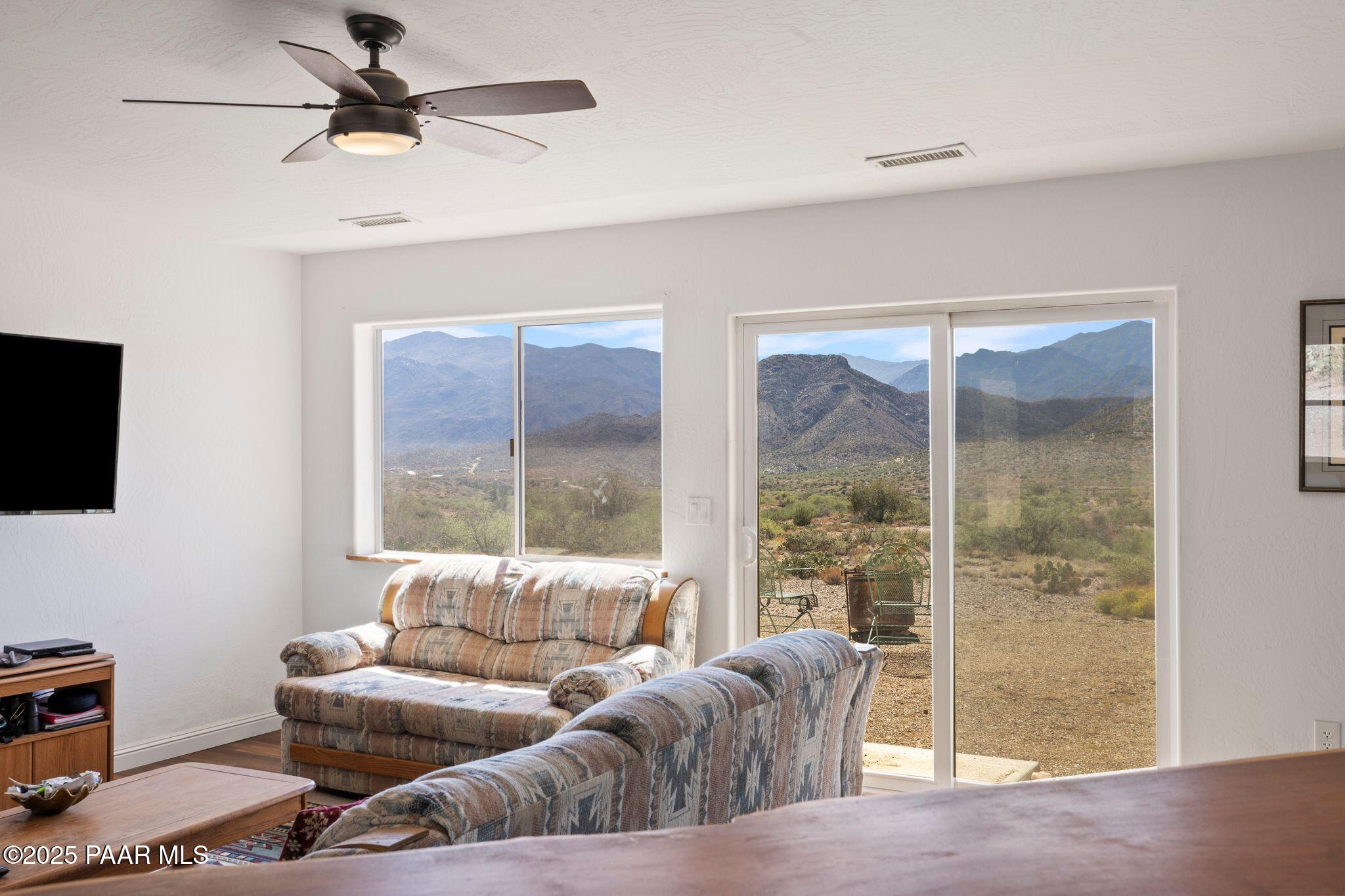 17200 South Dripping Springs Road Mayer, AZ 86333 - Photo 10 of 51 a living room with furniture a flat screen tv and a window