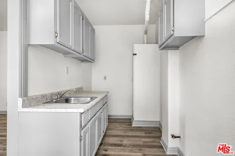 a view of a room that has a bed in it