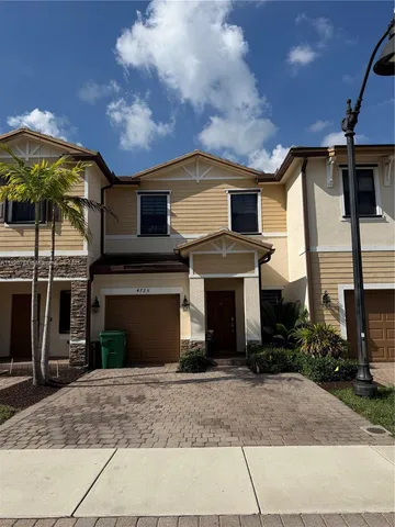 a front view of a house with yard