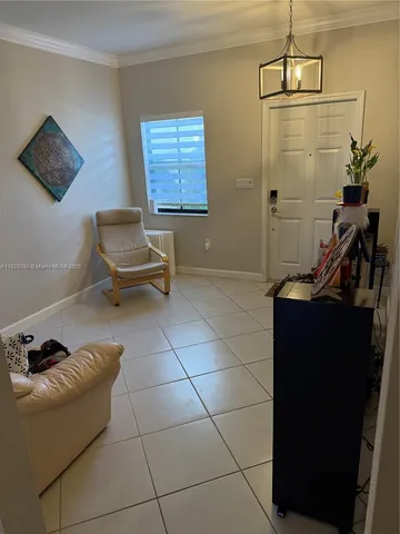 a living room with a couch and a flat screen tv