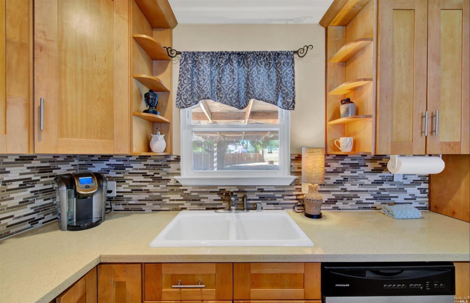 100 Arrowhead Court Vacaville, CA 95687 - Photo 12 of 40 a kitchen with a stove and a sink