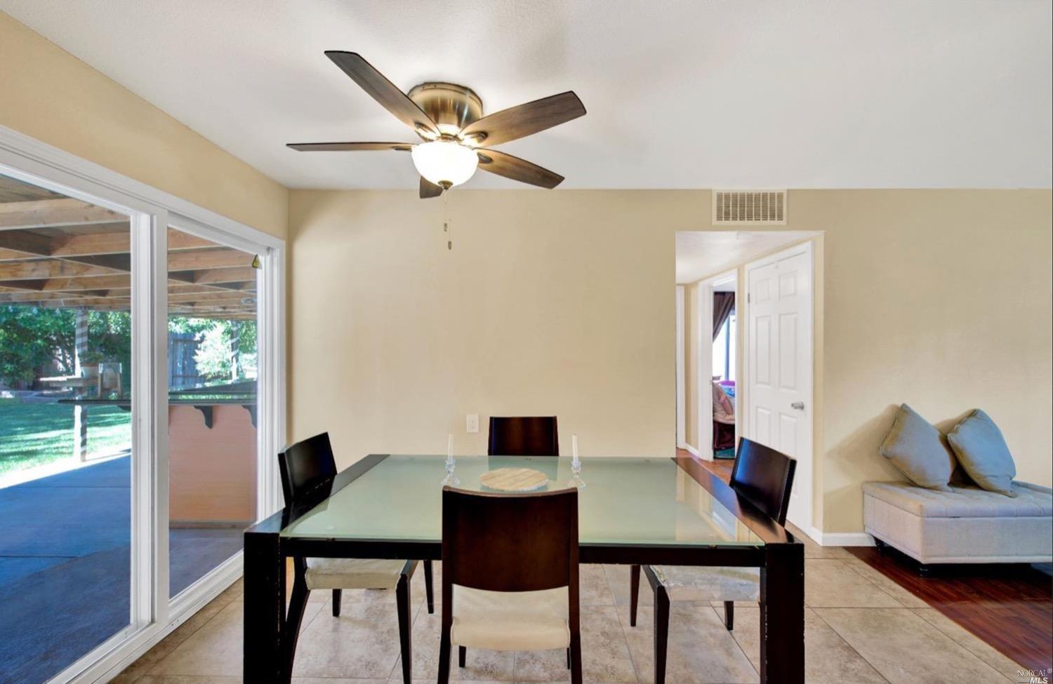 100 Arrowhead Court Vacaville, CA 95687 - Photo 15 of 40 a view of a dining room with furniture and a window