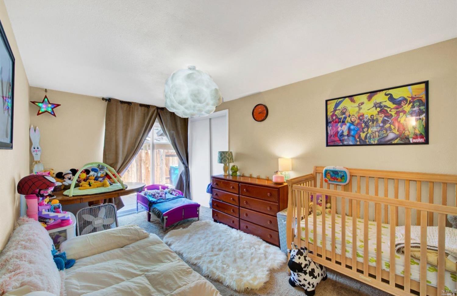 100 Arrowhead Court Vacaville, CA 95687 - Photo 19 of 40 a bedroom with furniture and a large window