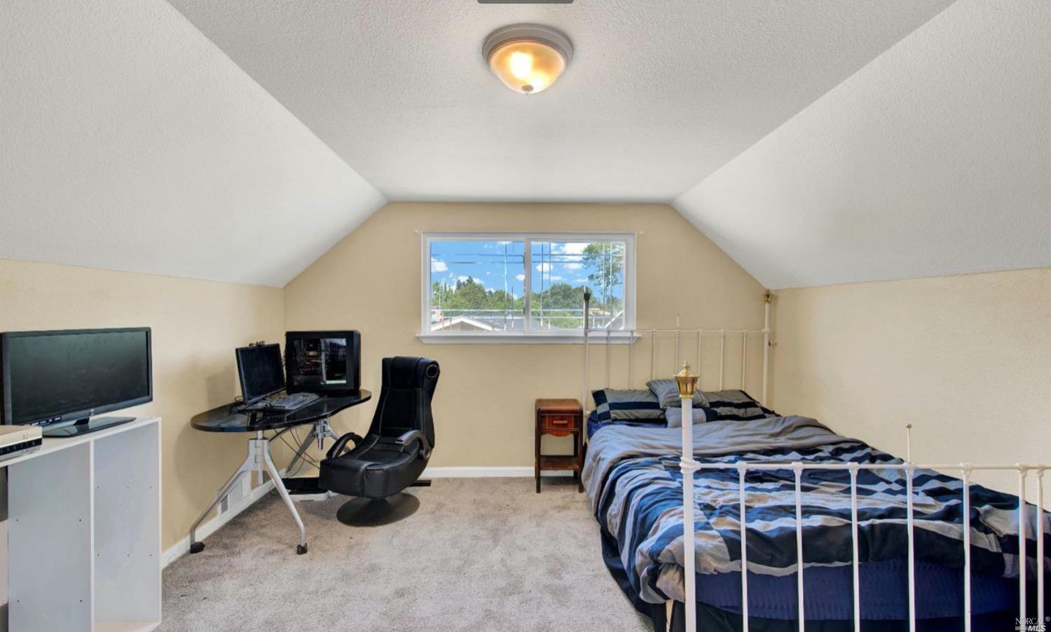 100 Arrowhead Court Vacaville, CA 95687 - Photo 21 of 40 a bedroom with a bed and a flat screen tv