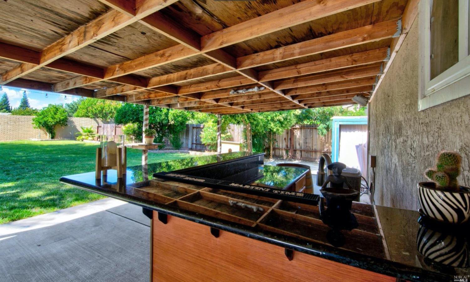 100 Arrowhead Court Vacaville, CA 95687 - Photo 28 of 40 a backyard of a house with glass table and chairs