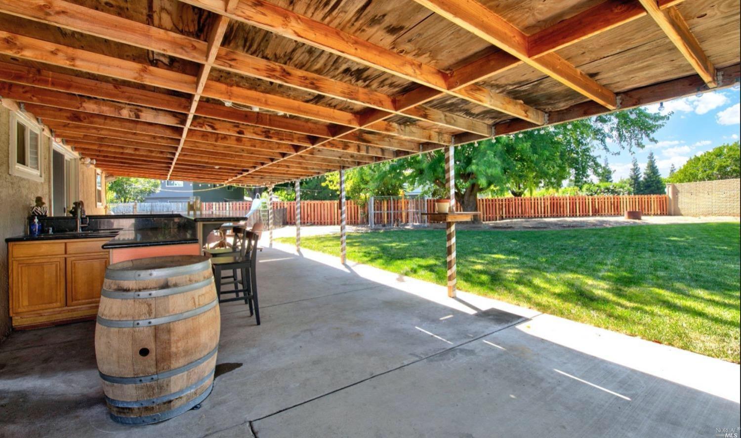 100 Arrowhead Court Vacaville, CA 95687 - Photo 30 of 40 a view of a backyard with plants and a patio