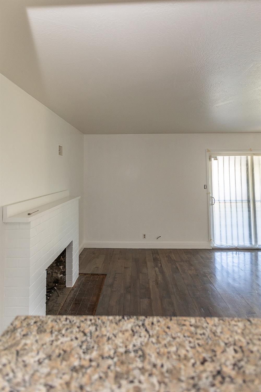 2105 Norman Way Modesto, CA 95350 - Photo 16 of 34 a view of a livingroom with wooden floor and staircase