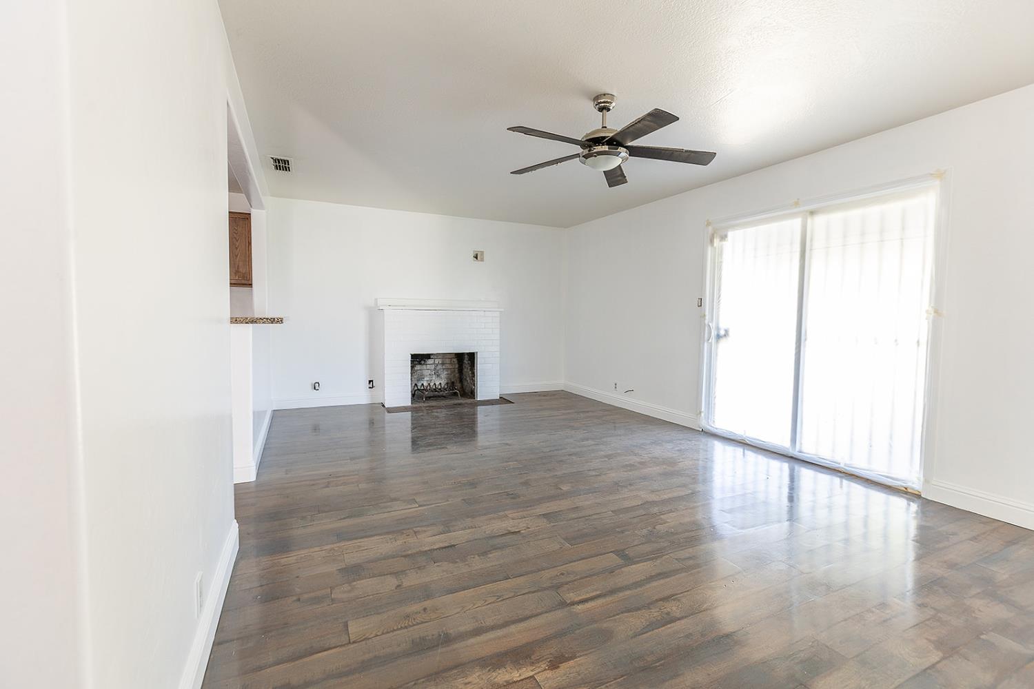 2105 Norman Way Modesto, CA 95350 - Photo 18 of 34 a view of empty room with wooden floor and fan
