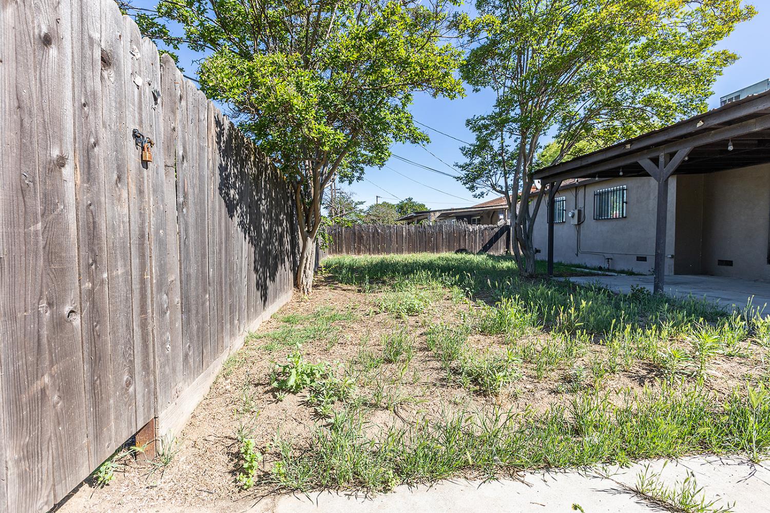 2105 Norman Way Modesto, CA 95350 - Photo 31 of 34 a backyard of a house with lots of green space
