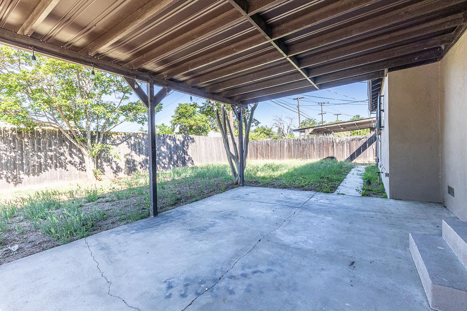 2105 Norman Way Modesto, CA 95350 - Photo 32 of 34 a view of a backyard with large trees
