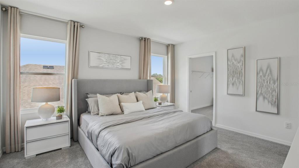 35293 Vly Rdg Road Dade City, FL 33525 - Photo 28 of 36 a bedroom with a bed and a painting on the wall