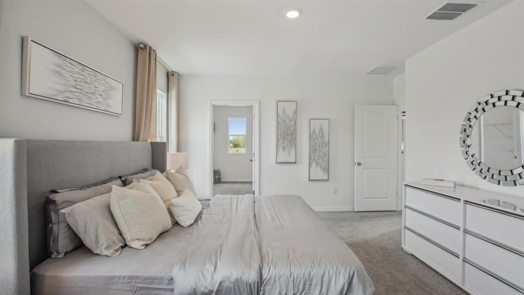 35293 Vly Rdg Road Dade City, FL 33525 - Photo 31 of 36 a bedroom with a bed and with furniture